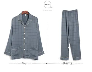 Detail view of men's silk pajamas featuring dark grey grid pattern and piping details