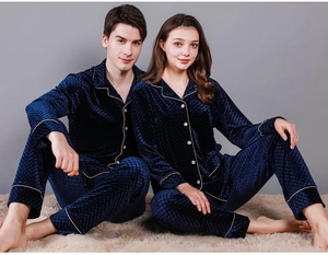 Detail of navy velvet pajama set featuring embossed diamond texture and gold trim