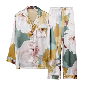 Women's two-piece floral satin pajama set with long-sleeve button-down shirt and matching pants