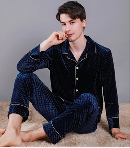 Macro view of men's velvet pajama set with diamond quilted texture and contrast piping