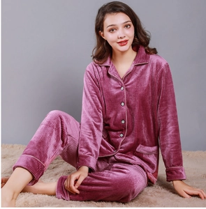 Detail of burgundy island velvet pajama set with plaid texture and button-up design