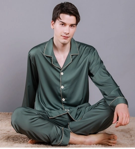 Detail of dark green silk satin pajama set for men with white piping and lapel collar