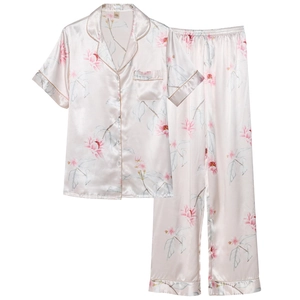 Women's silk pajama set featuring floral print short sleeve top and long pants