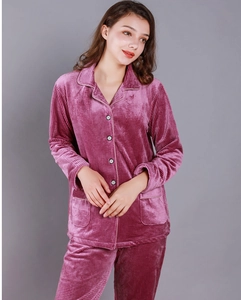 Detail of pink waffle-textured coral fleece pajama set with lapel collar and piping