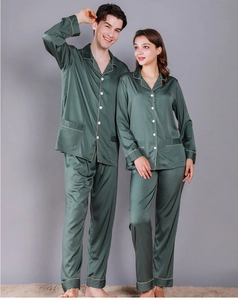 Deep forest green silk pajamas with elegant contrast piping and button-down lapels