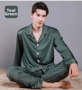 Detail of dark green silk satin pajama set featuring classic lapel and contrast piping