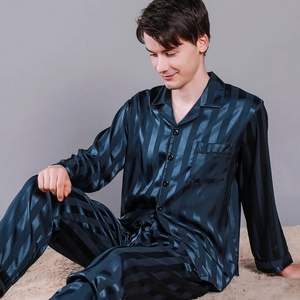 Men's navy striped silk pajama set featuring long sleeves and lounge pants for home wear