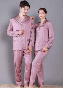Detail of pink satin couple pajama set featuring contrast piping and notched lapels