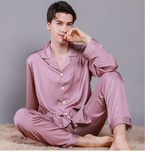 Close-up of men's silk pajama set in mauve featuring a lapel collar and satin finish