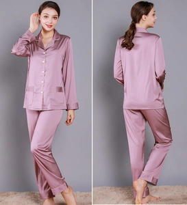 Detail of lavender silk pajama set showing lapel collar and piping contrast texture