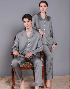 Detail of charcoal grey satin pajama set with contrast piping and premium silk texture