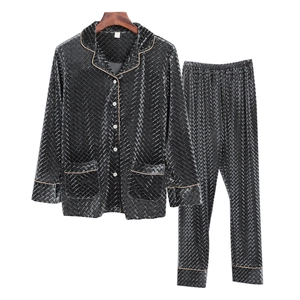 Men's velvet pajama set in black with textured geometric pattern and classic lapel collar