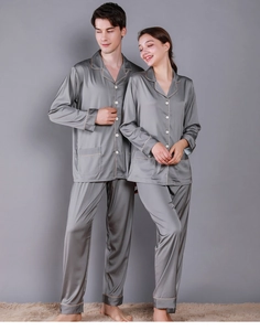 Close-up of luxury dark grey satin couple pajamas with contrast piping and silk-like texture