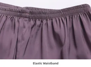 Close-up of elastic waistband on satin pajama pants showing flexible comfort and stitching