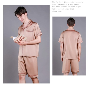 Detail view of men's short sleeve satin pajama set in champagne gold with contrasting trim
