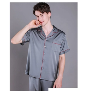 Detail of premium grey silk satin men's pajamas with elegant red piping and chest pocket