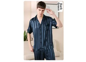 Detail of dark green striped silk pajamas set with short sleeve shirt and long pants