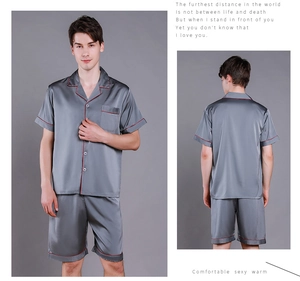 Front and back view of dark grey men's satin silk pajamas with red piping detail