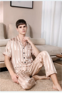 Detail of men's satin striped pajama set featuring short sleeve button-down top and pants