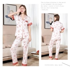 Short sleeve ice silk pajama set for women with exotic sun print and red contrast trim