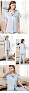 Details des Seidenpyjama-Sets mit Spitzenbesatz und Knöpfen an Oberteil und langer Hose
