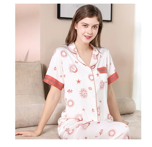 Silk satin pajama set featuring red constellation prints and contrast piping detail