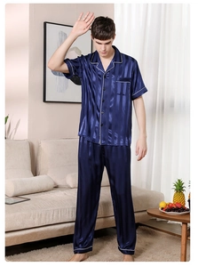 Detail of dark blue striped satin men's pajama set featuring short sleeves and long pants