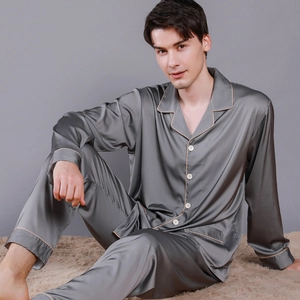 Men's dark gray silk satin pajama set with long sleeves and gold piping details