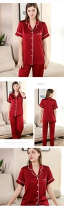 Detail eines dunkelroten Satin-Pyjama-Sets mit weißen Wellenspitzenbesatz und Hemd