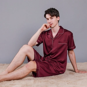 Men's burgundy silk satin pajama set with short sleeve button-down top and matching shorts