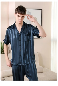Detail of dark blue striped silk pajama set featuring a short sleeve shirt and long pants