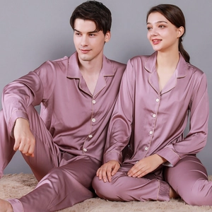 Matching dusty pink silk pajamas set for couples with contrast piping and lapels