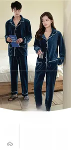 Detail of soft navy blue flannel pajama set with white piping and warm thick texture