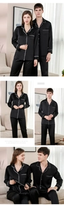 Détail de pyjamas de couple en satin de soie noir avec passepoil blanc et poche poitrine