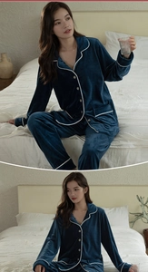 Detail of navy blue velvet pajamas showing white piping on lapels and pocket design