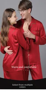 Detail of red silk pajama set featuring elegant floral jacquard fabric and piping