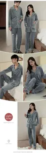 Close-up detail of light grey coral fleece couple pajamas with white piping and pockets
