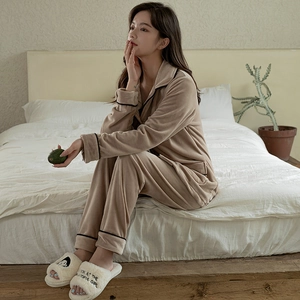 Light brown velvet long-sleeve pajama set with black trim and soft fleece texture