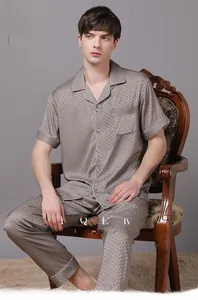 Detail of men's ice silk pajama set with geometric diamond pattern and white piping