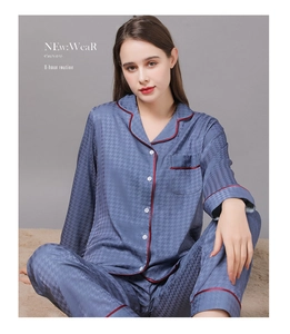 Detail of blue silk pajamas with red piping and textured houndstooth jacquard fabric