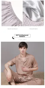 Detail of elastic waistband and smooth satin fabric with geometric pattern on men's pajamas