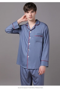 Detail of men's grey silk pajama set with houndstooth texture and red piping accents