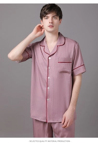 Detail view of men's short sleeve silk pajamas set with houndstooth pattern and contrast piping