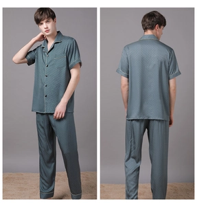 Detail of teal silk-like pajama set for men with subtle diamond texture and contrast piping