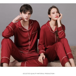 Detail of burgundy silk pajamas with houndstooth pattern and contrast piping trim