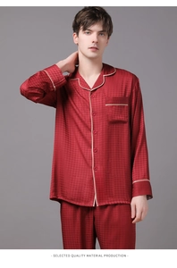 Detail of men's silk pajama set featuring dark red houndstooth texture and piping