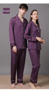 Detail of purple silk pajamas with houndstooth texture and golden piping trim