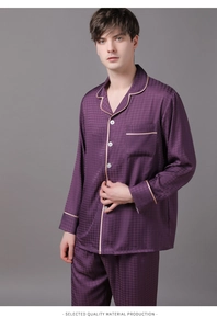 Detail view of purple silk satin pajama set with subtle houndstooth texture and white piping