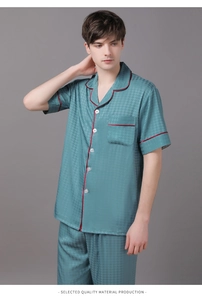 Men's silk satin pajamas in teal with houndstooth texture and red contrast piping