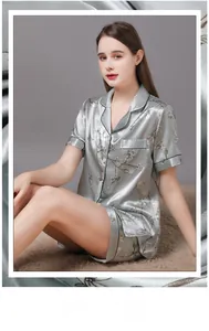 Detailed fabric analysis of floral silk satin women's pajamas in sage green